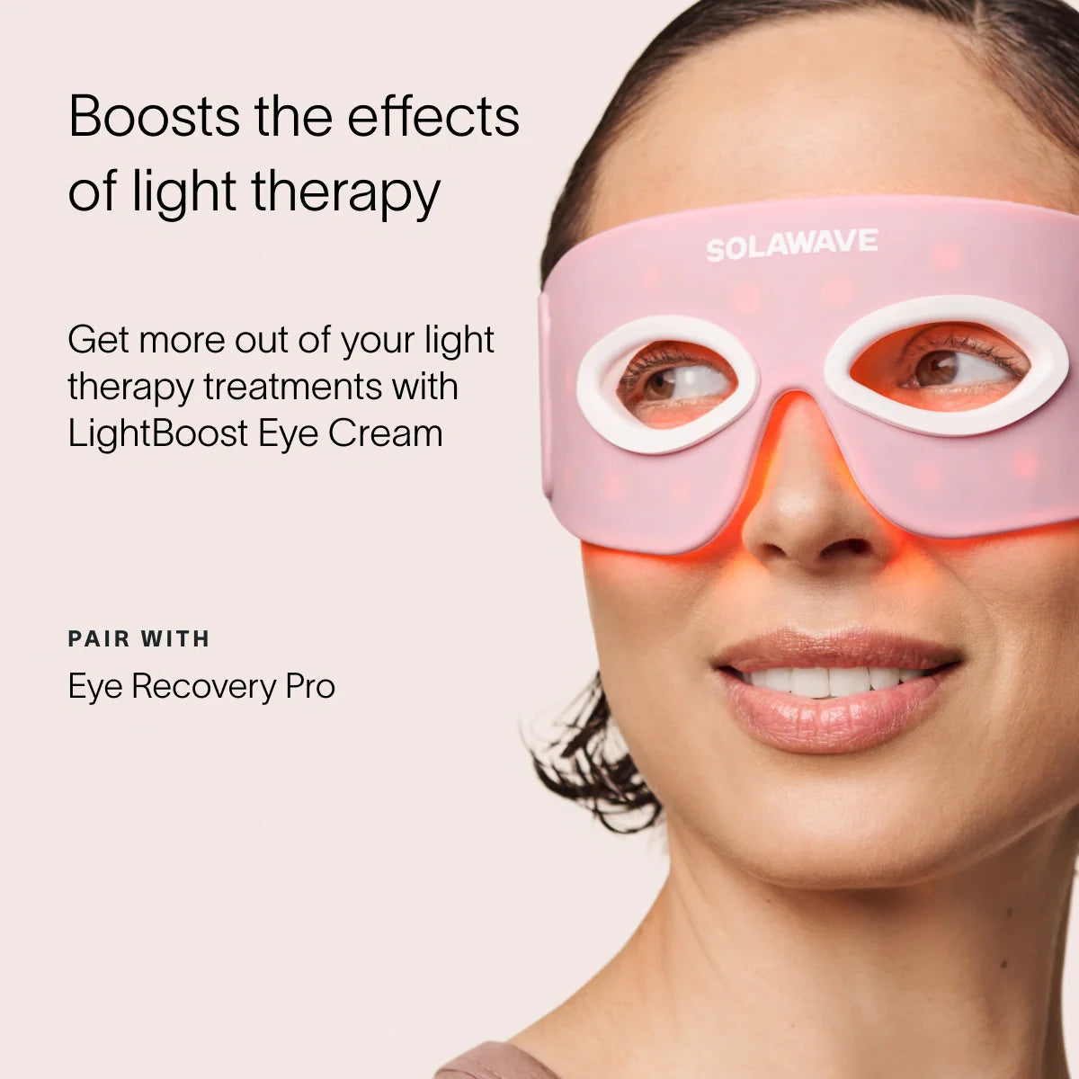 A woman wearing a pink and white LED light therapy mask looks to the side. The text promotes Solawaves LightBoost Eye Cream, enriched with vegan collagen, perfectly paired with Eye Recovery Pro to enhance light therapy effects.