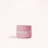 A pink jar labeled Solawave Light Therapy Boosting Face & Neck Cream sits on a light pink background. This anti-aging cream supports lifting, plumping, and collagen, with directions for daily use.