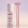 A skincare product and a red-light therapy device on a gradient background.