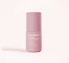 A pink bottle labeled Solawave Light Therapy Boosting Face & Neck Serum stands upright on a light background, with product details and features printed in white text on the front.