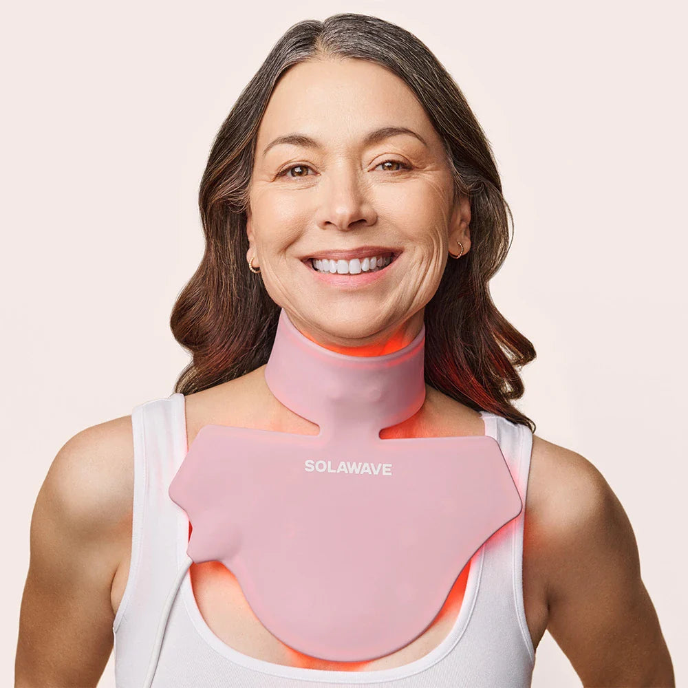 An image of a woman wearing a red light therapy for neck and chest