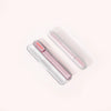 Three Solawave Radiant Renewal Skincare Wands, two white and one pink, feature a sleek cylindrical design with small lights. Positioned diagonally against a light background, they elegantly display the brand name. Ideal for home or travel use with a handy carrying case for convenience. || Clear